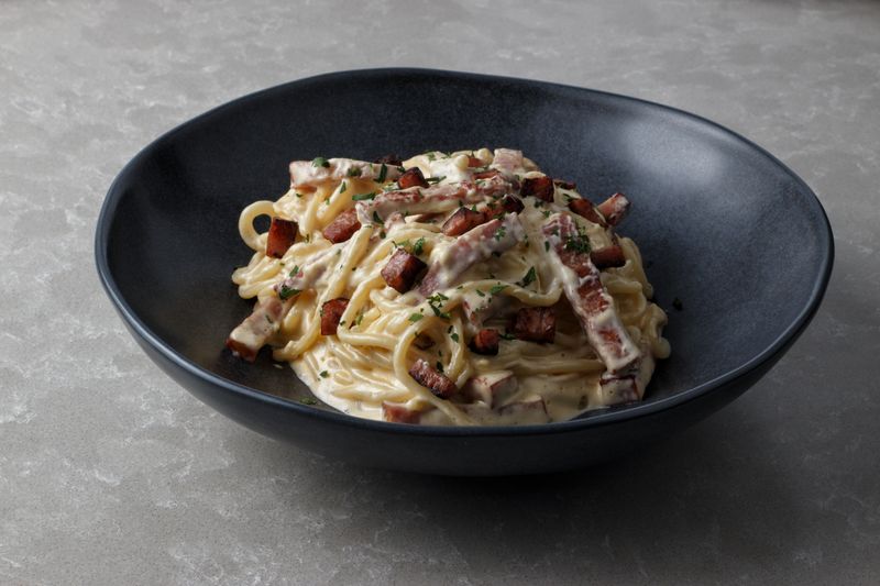 Spaghetti Carbonara pasta with pancetta and egg at Marcos